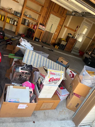 Boxes and household items gathered during a garage cleanout