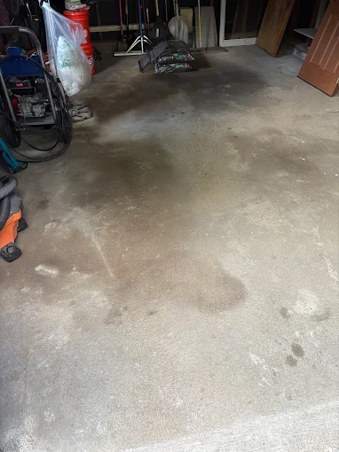 Open concrete garage floor after a cleanout